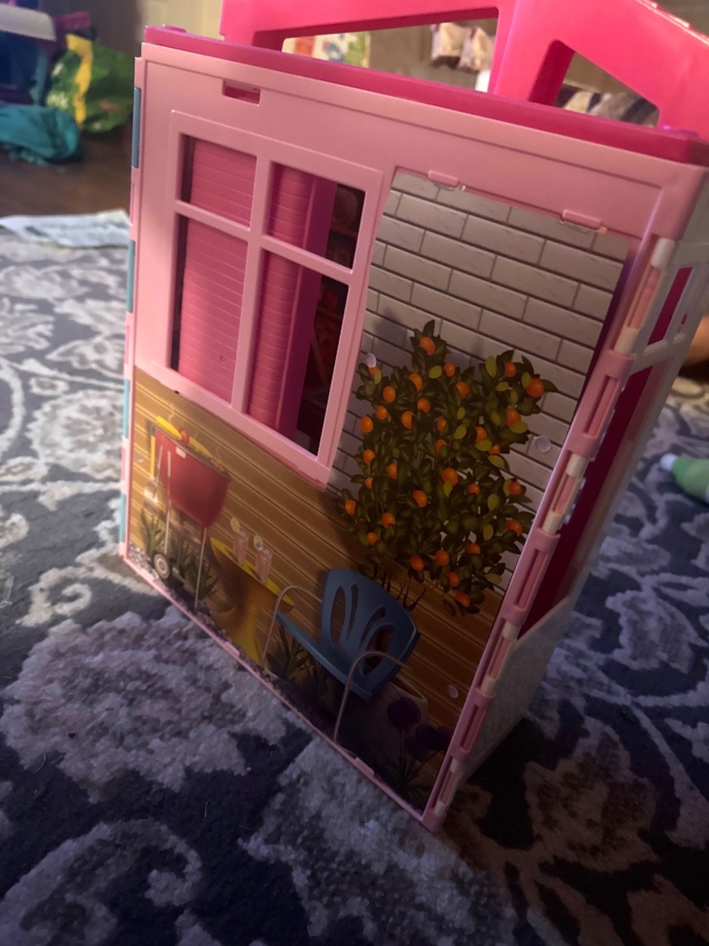 Barbie Close & Go House, a portable, fully furnished playset that unfolds for 36